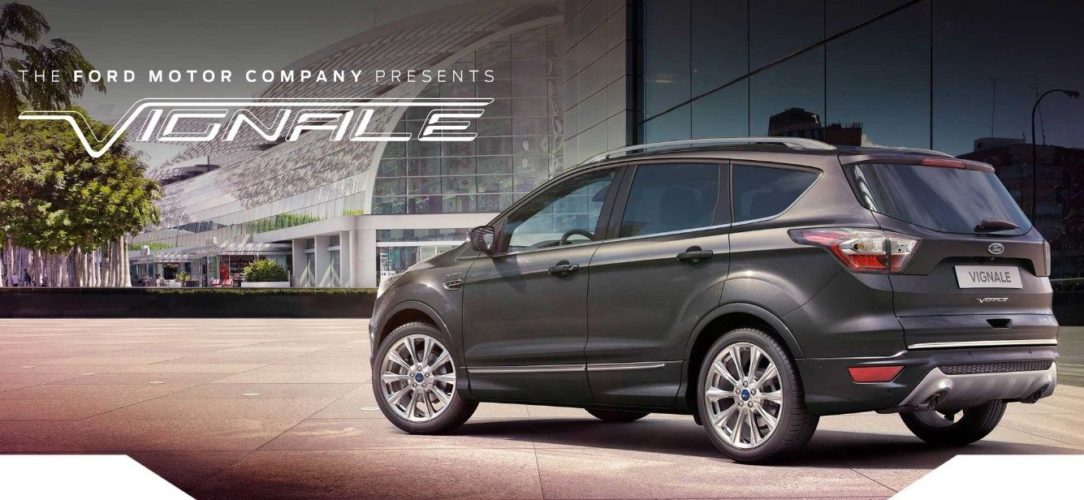 ford-kuga_vignale-eu-3_VIGK_M_L_37300-21x9-2160x925-bb-grey-kuga-parked-by-glass-building.jpg.renditions.extra-large